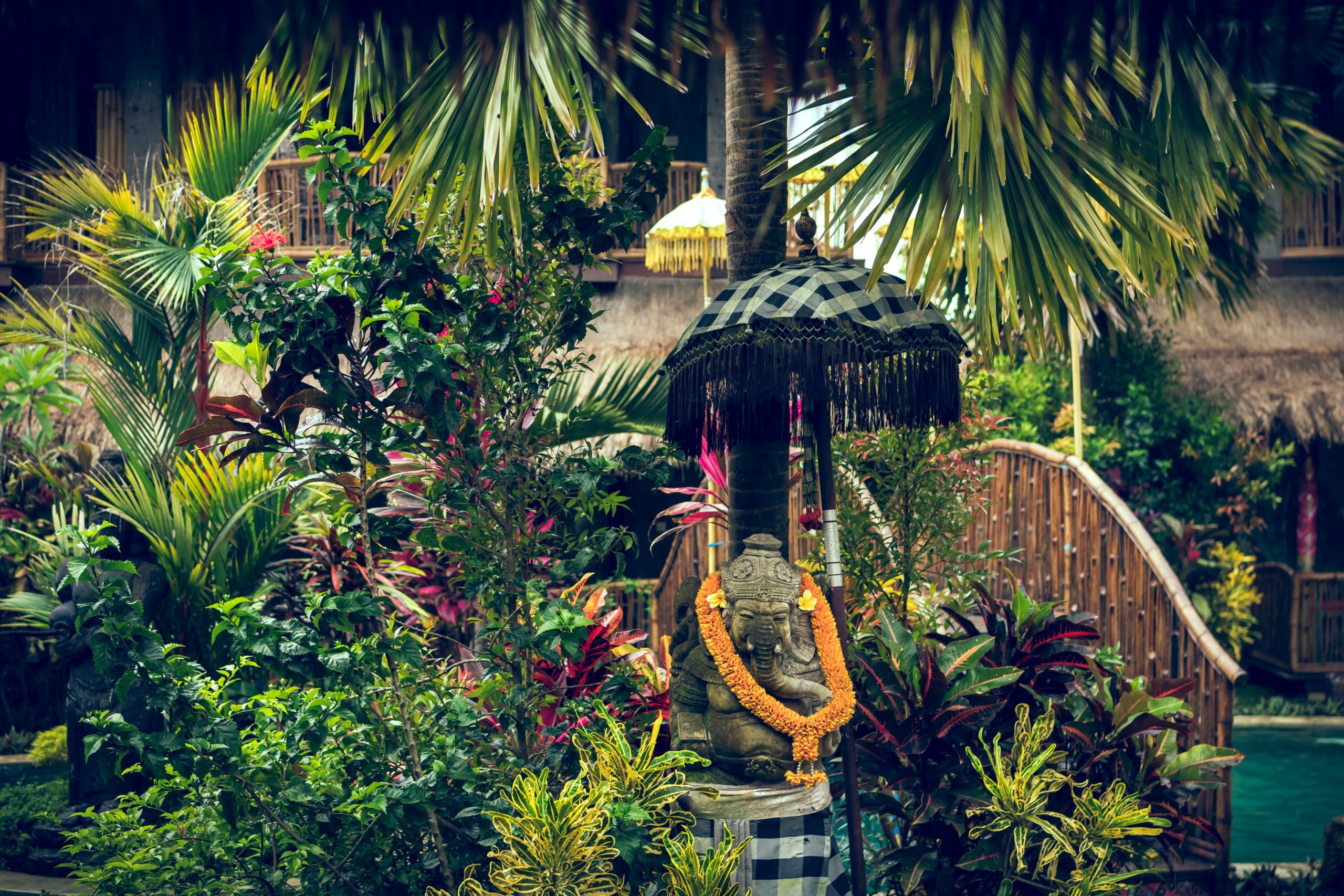 Festive religious stature surrounded by greenery